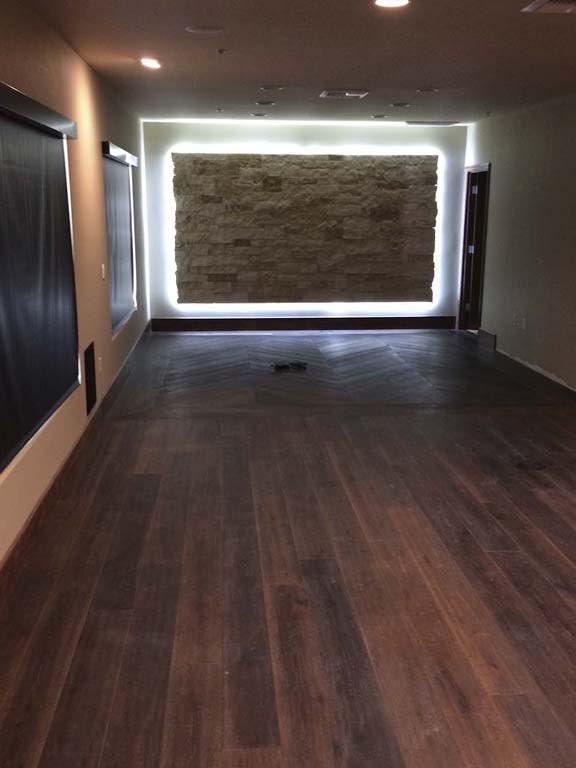 Executive Office Suite: Hallway to the stone wall