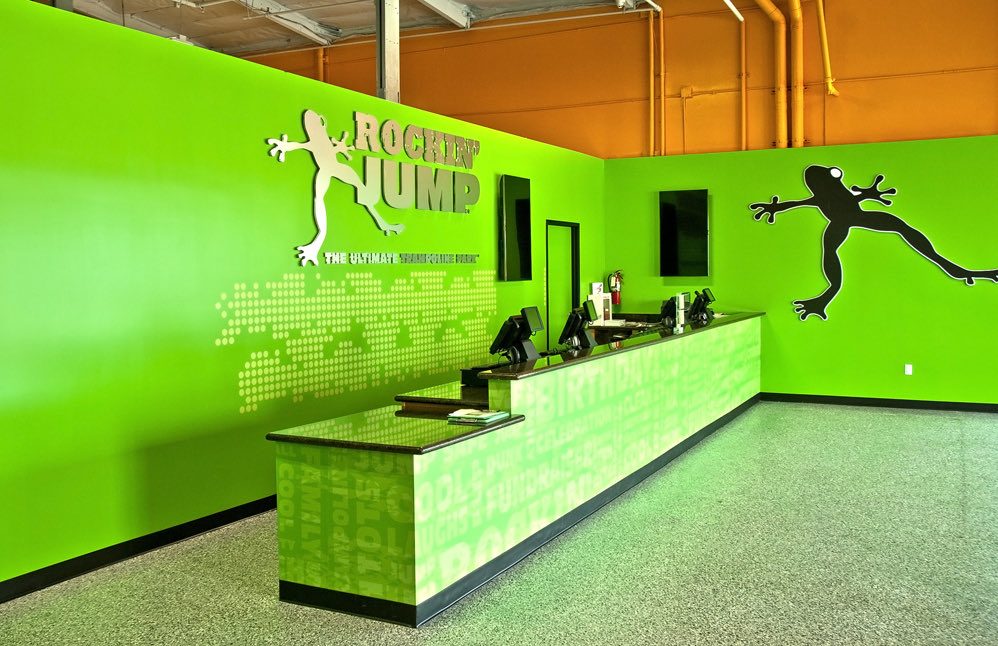 Rockin' Jump: Front desk with the frog logo wall