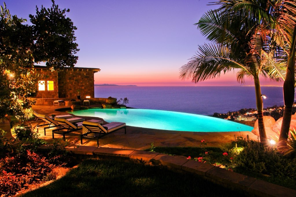 Laguna Beach hillside estate: infinity-edge pool at sunset